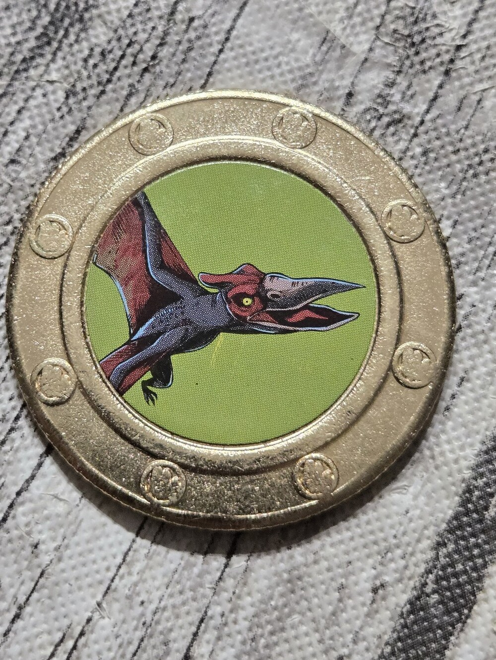 collectible Frankford Jurassic World Surprise Coin featuring a Pteranodon